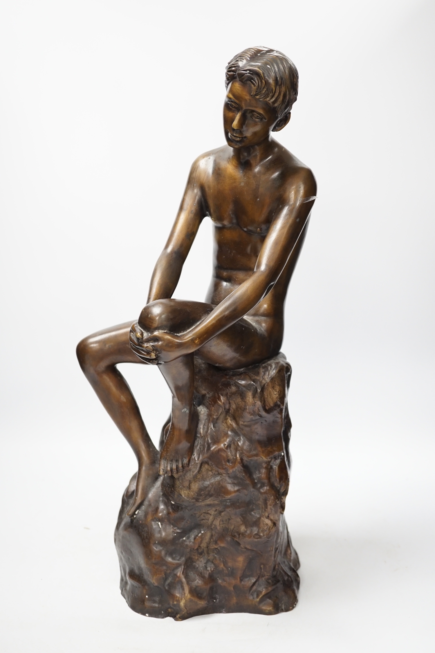 A bronze seated nude, 50cm